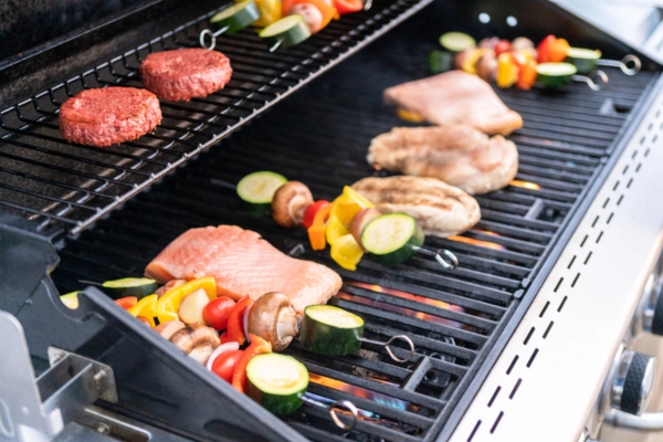propane-powered grill outside the house