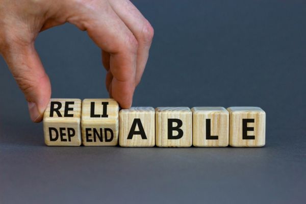 RELIABLE DEPENDABLE words spelled using wooden letter cubes depicting heating oil